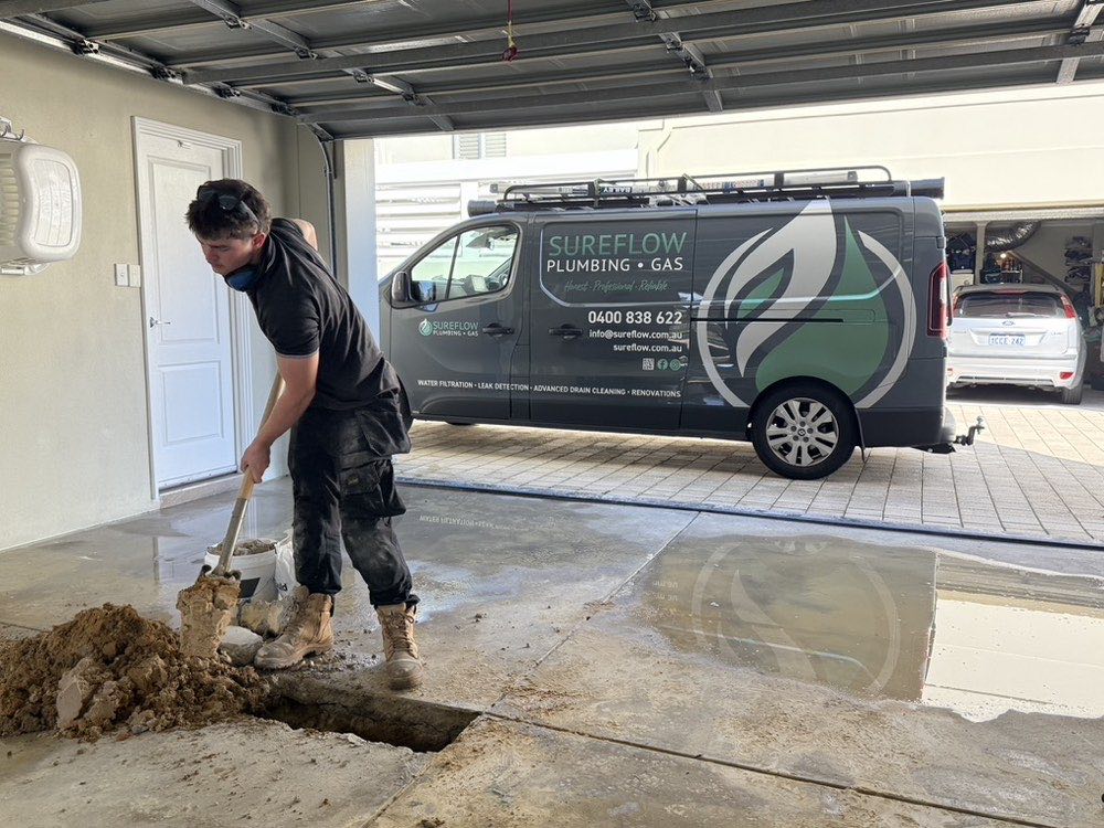 Sureflow plumber working on site at a Wanneroo property with the company van